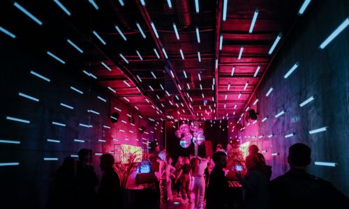 a group of people standing around in a room