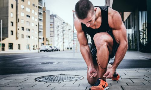 man tying his shoes
